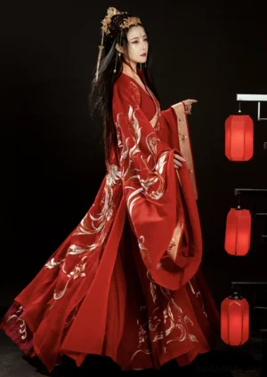 Female Wei Jin Dynasty bridal hanfu with red phoenix embroidery, cross-collar top, wide sleeves, golden trim, and traditional wedding hair ornaments