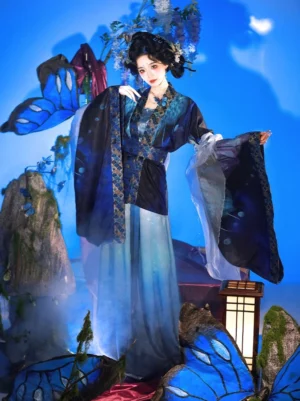Wei Jin Dynasty feather and butterfly Qiyao Ruqun Hanfu full set in indigo teal and gradient blue with wide sleeves and fantasy butterfly studio backdrop