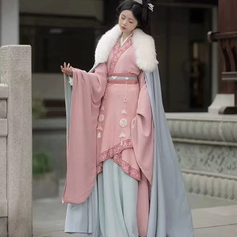 Wei Jin Dynasty Hanfu full outfit with matching pink and light blue layers white fur collar embroidered trims and jade waist pendants in an ancient courtyard