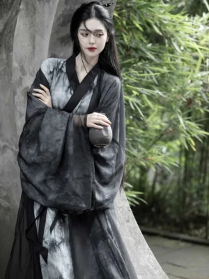 Wei Jin Dynasty Hanfu Qiyao Ruqun set in black and grey ink wash style, female model wearing a cross-collar robe and sheer wide-sleeve outer coat in a bamboo garden