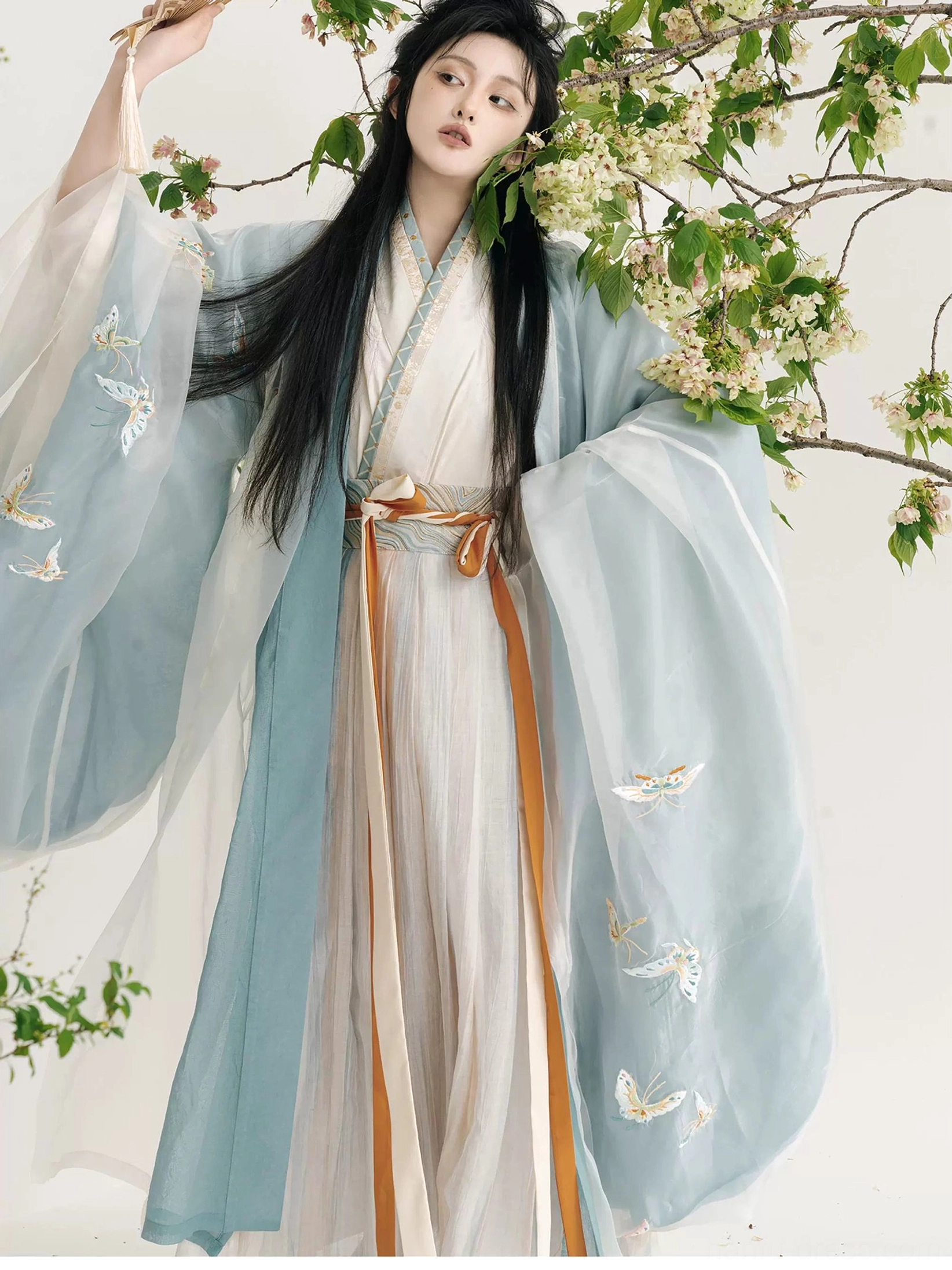 Wei Jin Dynasty Hanfu side view showing elegant loose Qiyao Ruqun silhouette wide embroidered sleeves and tied waist ribbons