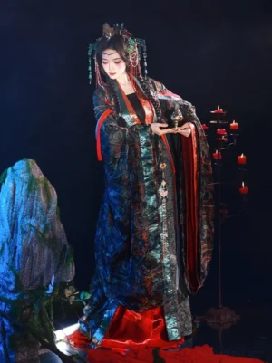 Front three-quarter view of a Wei Jin Dynasty immortal Hanfu with flowing wide sleeves, dark green and black patterned fabric, vivid red inner layers, and a bronze censer in a mystical xianxia studio setting