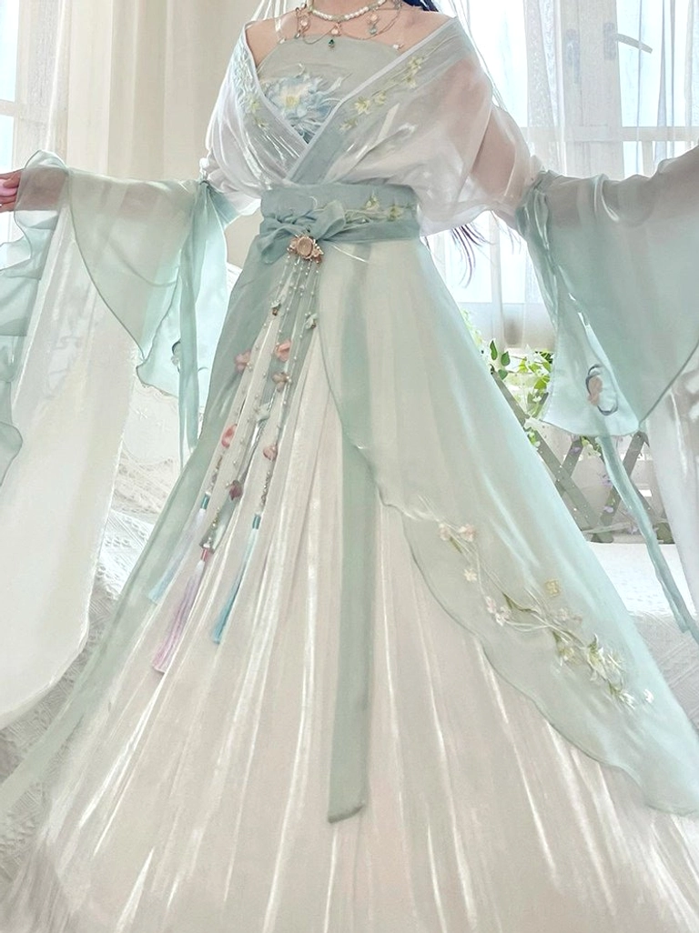 Front full-body view of Wei Jin Dynasty inspired mint green Hanfu set with floral embroidery wide sleeves and decorative waist sash
