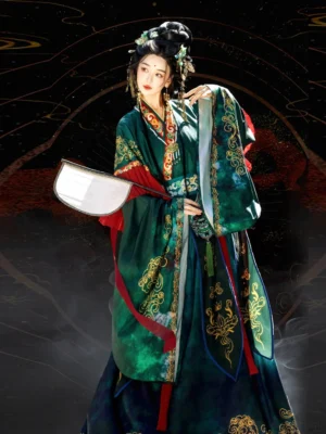 Emerald green Wei Jin Dynasty Hanfu with gold traditional cloud patterns, red collar trim, layered skirt, and white silk fan in front three quarter view