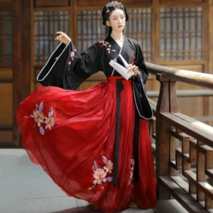 Wei Jin Dynasty Qiyao Ruqun Hanfu full view with black floral embroidered cross-collar top, wide white-trimmed sleeves, flowing red chiffon skirt, and traditional Chinese courtyard setting