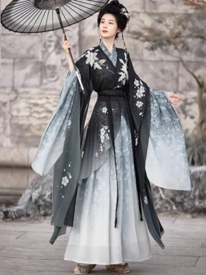 Three-quarter front view of black and ivory Wei Jin Dynasty Hanfu Qiyao Ruqun with floral motifs and flowing gradient skirt