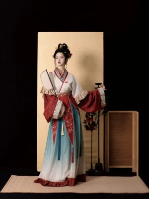 Wei Jin Dynasty Qiyao Ruqun Hanfu in cream white, red, and blue gradient with floral embroidery, layered vest, flowing skirt, and traditional round silk fan