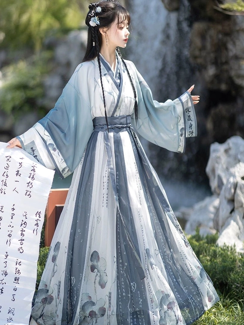 Blue Wei Jin Dynasty Qiyao Ruqun Hanfu full set with ivory pleated lotus print skirt photographed by a waterfall garden