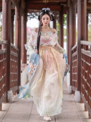 Front view of a Wei Jin Dynasty Qiyao Ruqun Hanfu in a dreamy apricot and light blue gradient, featuring wide sleeves, floral embroidery, and an elegant traditional Chinese silhouette