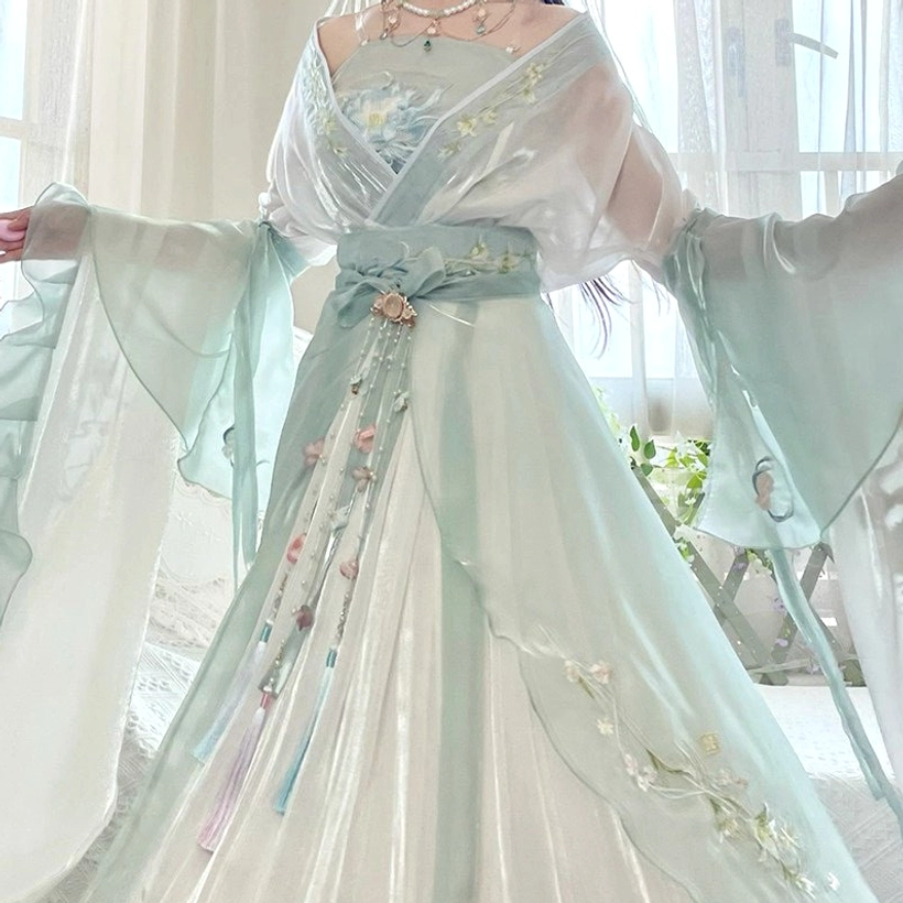 Full Wei Jin Dynasty Qiyao Ruqun Hanfu set in mint green and ivory with floral waist brooch tassel ornaments and flowing chiffon sleeves
