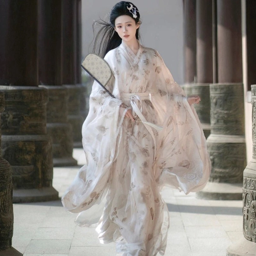 Full-body front view of Wei Jin Dynasty Qiyao Ruqun Hanfu with white sash, flowing floral printed layers, traditional silk fan and ancient Chinese hairstyle in a stone courtyard