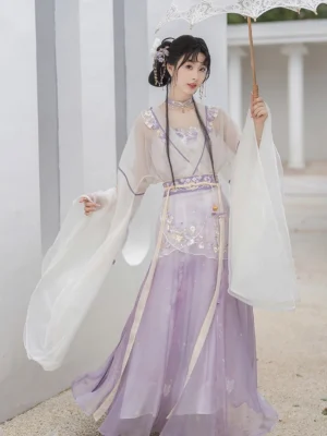 Front full-body view of a Wei Jin Dynasty Qiyao Ruqun Hanfu in ivory and gradient lavender with purple iris embroidery, flowing wide sleeves, traditional hair accessories, and a lace parasol