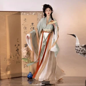 Wei Jin Dynasty Qiyao Ruqun Hanfu in light cyan, ivory, and green with pleated skirt, layered sleeves, and traditional folding fan