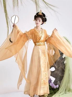 Apricot yellow Wei Jin Dynasty Hanfu Qiyao Ruqun with flowing translucent sleeves, high waist skirt, gold tassel belt, and open-arm pose