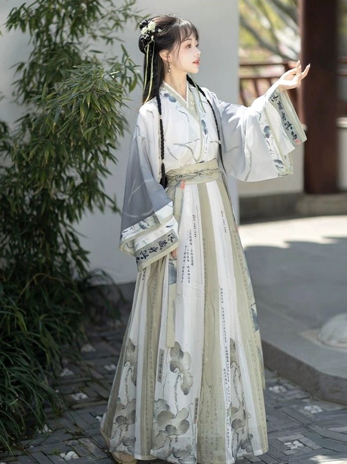 Wei Jin Dynasty Qiyao Ruqun Hanfu lotus print wrap skirt and wide sleeve traditional Chinese outfit shown in a bamboo garden