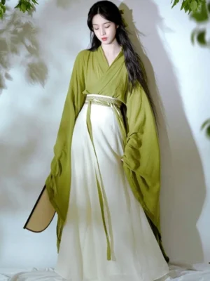 Front full-body view of an olive green and ivory Wei Jin Dynasty Qiyao Ruqun Hanfu with wide sleeves, cross-collar top, flowing skirt, and matching waist sash