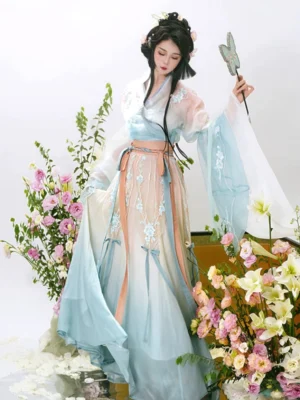 Wei Jin Dynasty qiyao ruqun Hanfu in Pear Blossom Fall gradient blue apricot and ivory colors with wide embroidered sleeves and floral studio styling