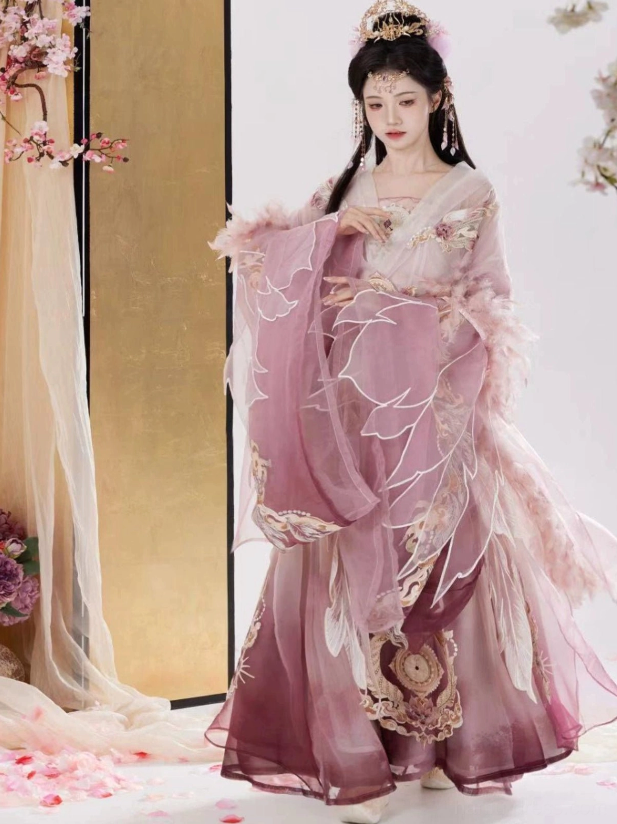 Front three-quarter view of a Wei Jin Dynasty Qiyao Ruqun Hanfu in a pink and purple gradient with feather-trimmed wide sleeves, floral embroidery, golden skirt details, and traditional Chinese styling