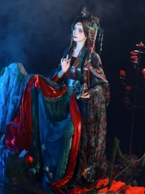 Side view of dark fantasy Wei Jin Dynasty Hanfu showing the long wrap skirt, jacquard-style pattern, red hem details, and metallic-look waist styling in an ancient Chinese setting
