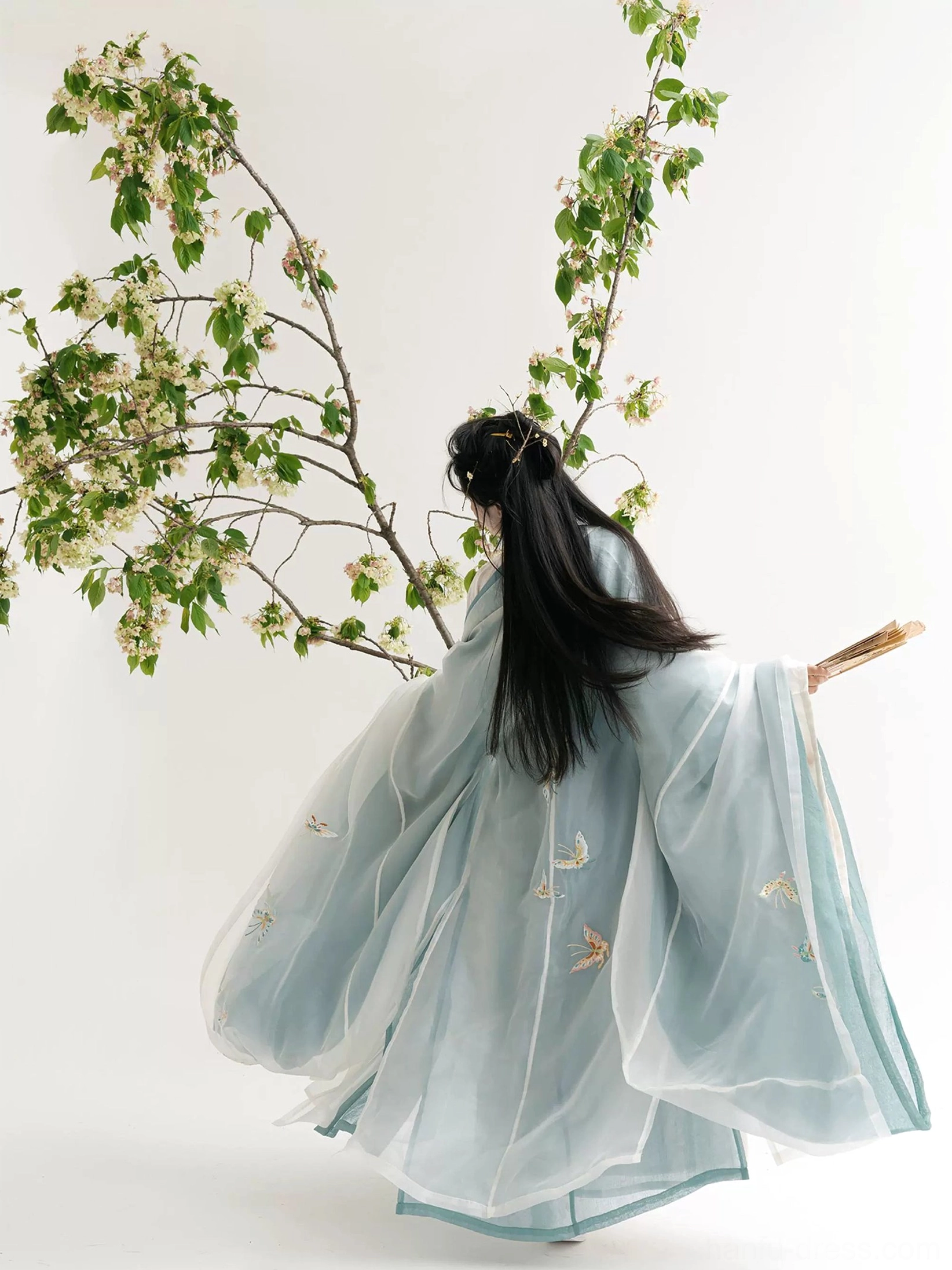 Back view of complete Wei Jin style Qiyao Ruqun Hanfu with butterfly embroidery on the outer robe flowing sleeves and layered skirt
