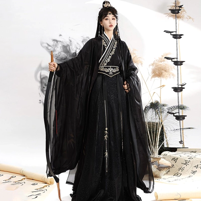 Rear three-quarter view of a full black and gold Wei Jin Dynasty Qiyao Ruqun Hanfu with matching sheer outer robes and floor-length embroidered skirt