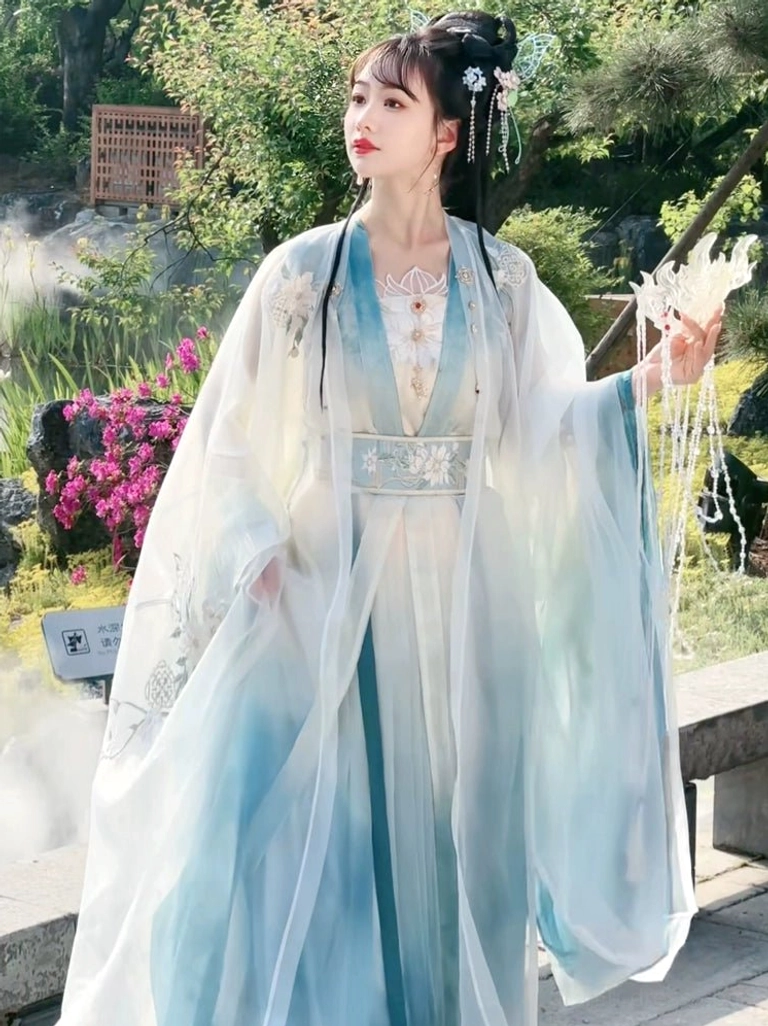 Side view of Wei Jin Dynasty inspired Qiyao Ruqun Hanfu with ivory to cyan sheer robe embroidered waist belt and flowing sleeves