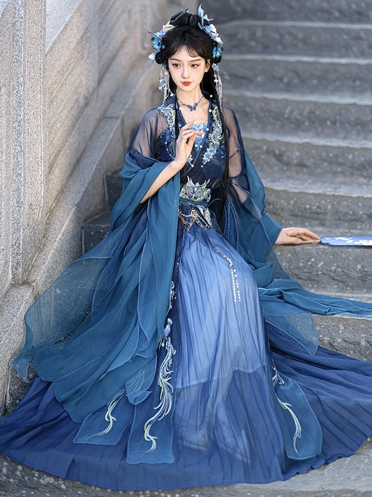 Full Wei Jin Dynasty Qiyao Ruqun Hanfu outfit with floor-length pleated navy skirt, chiffon shawl sleeves, and delicate embroidery shown on stone steps