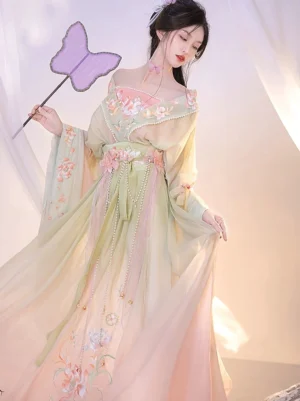 Yellow and pink gradient Qiyao Ruqun Hanfu with floral embroidery, off-shoulder wide sleeves, flowing skirt, and purple butterfly fan