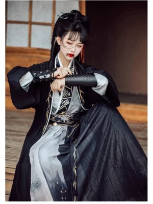 Wei Jin style Qiyao Ruqun Hanfu sitting pose with embroidered black arm guards, flowing outer robe, gradient ink wash skirt, gold thread details, and decorative waist belt