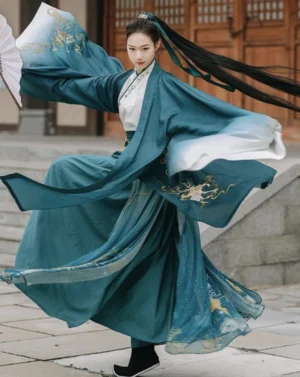 Wei Jin wuxia hanfu ruqun in dark teal and ivory gradient with flowing sleeves and golden mountain pavilion embroidery, shown from a dynamic front view