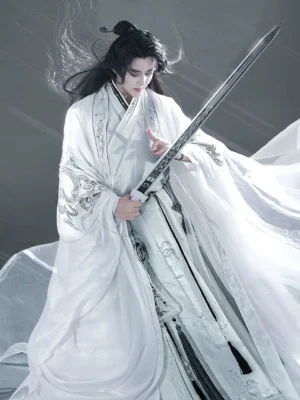 Three-quarter view of male model wearing white xianxia hanfu with silver embroidered layers, long wide-sleeve coat and flowing traditional Chinese robe train