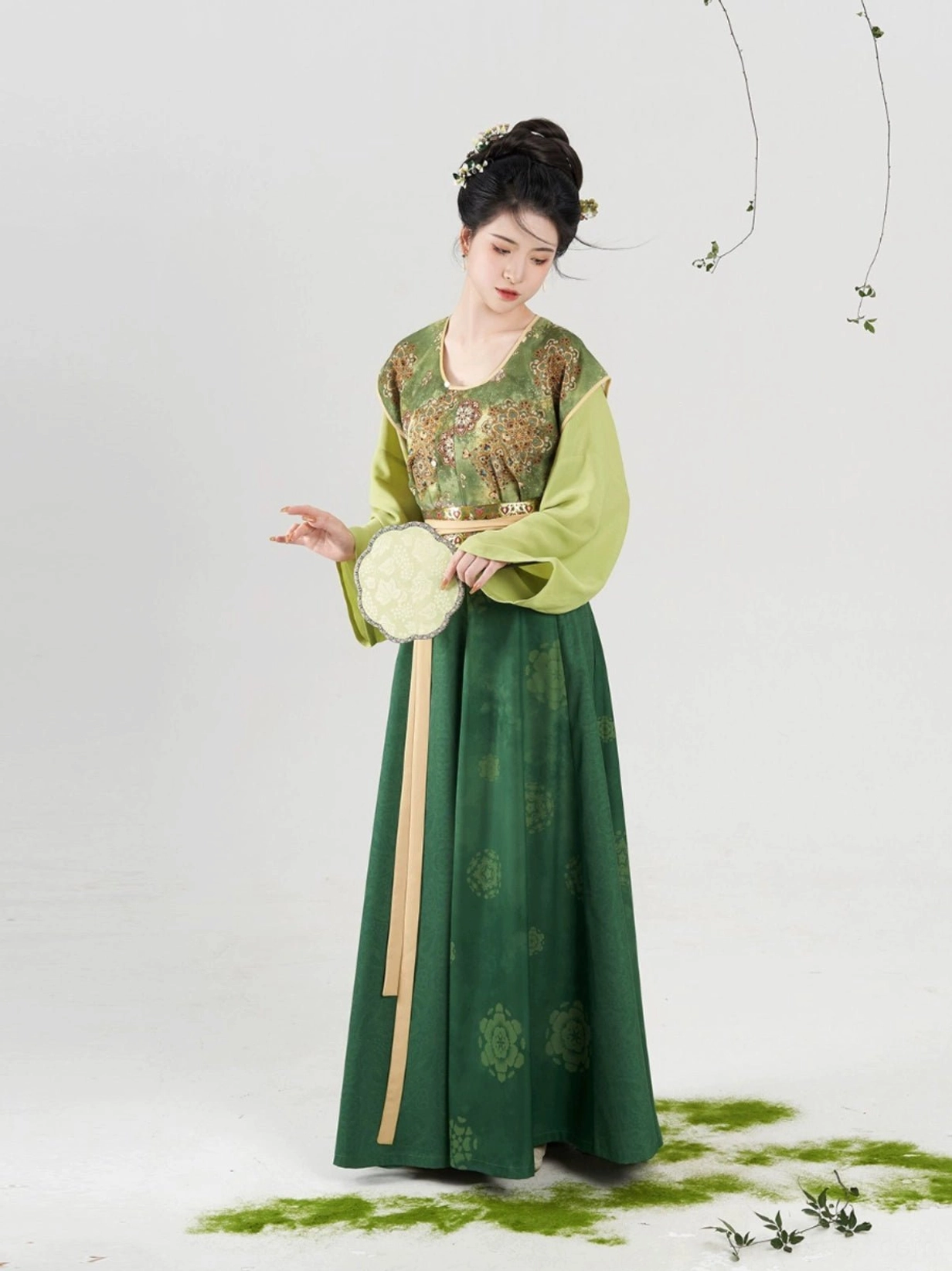 Front detail of Weiyang green Tang Dynasty Hanfu with floral brocade beizi overlay and silk fan