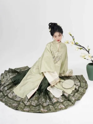 Ming Dynasty Hanfu full outfit shown from above with layered green overcoat and flowing pleated mamian skirt