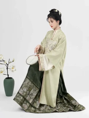 West Lake Ming Dynasty Hanfu full set with pistachio green overcoat, embroidered robe and dark green mamian skirt side view