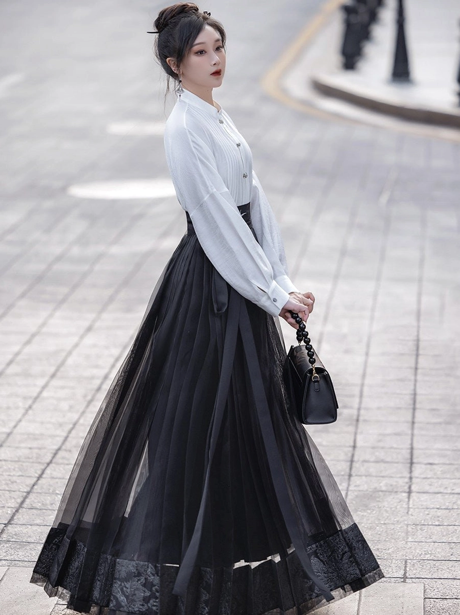 Back view of white Chinese style stand collar blouse paired with a black sheer lace hem mamian skirt