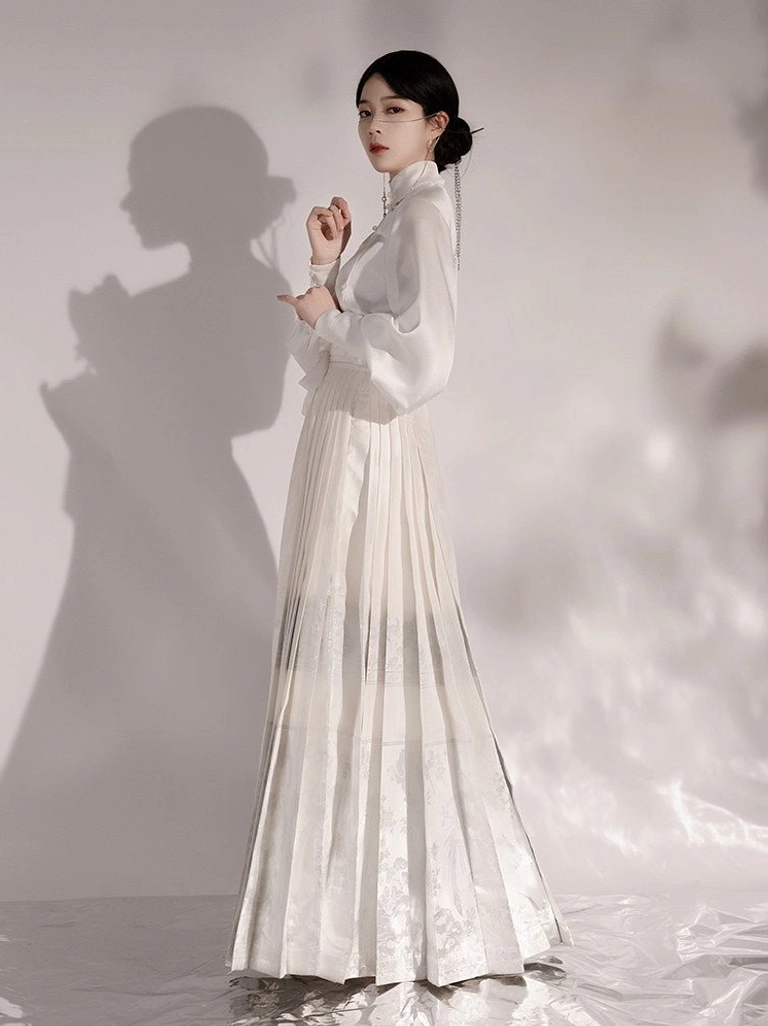 White Ming Dynasty inspired Hanfu set featuring lantern sleeve stand collar blouse and fitted pleated mamianqun skirt side view