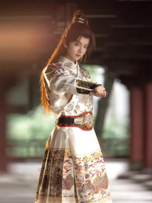 White Ming Dynasty Jinyiwei Feiyufu traditional hanfu for men shown from a side three-quarter angle in a warm wooden corridor, with intricate Chinese patterns, black decorative belt, and elegant historical styling