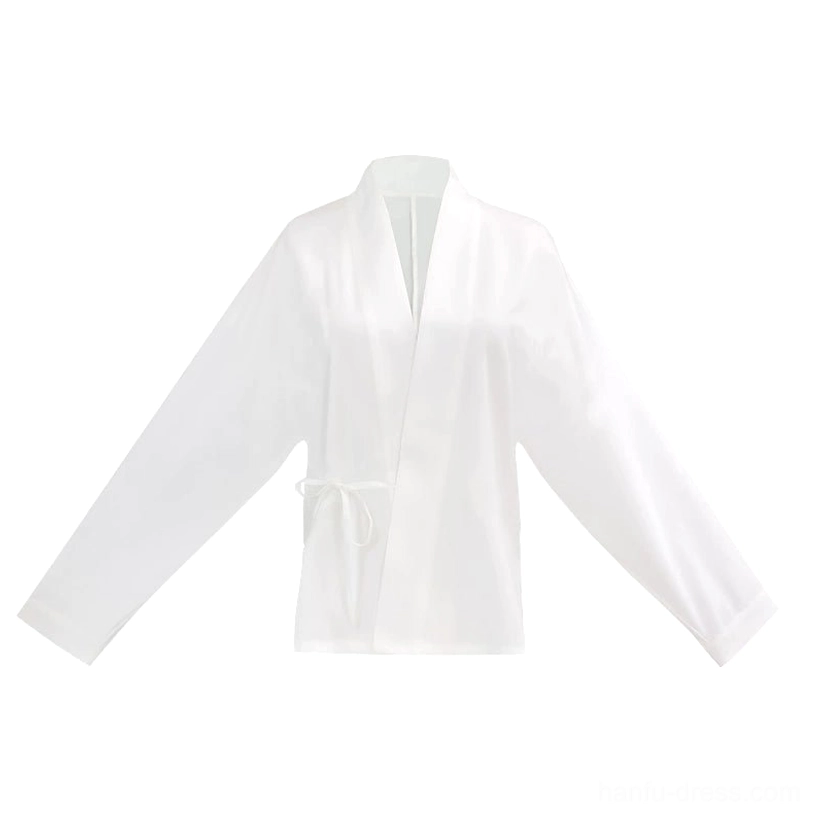 Flat lay view of a white Ming-style cross-collar Hanfu blouse with wrap-front design, long lantern sleeves, side tie closure, and smooth matte fabric