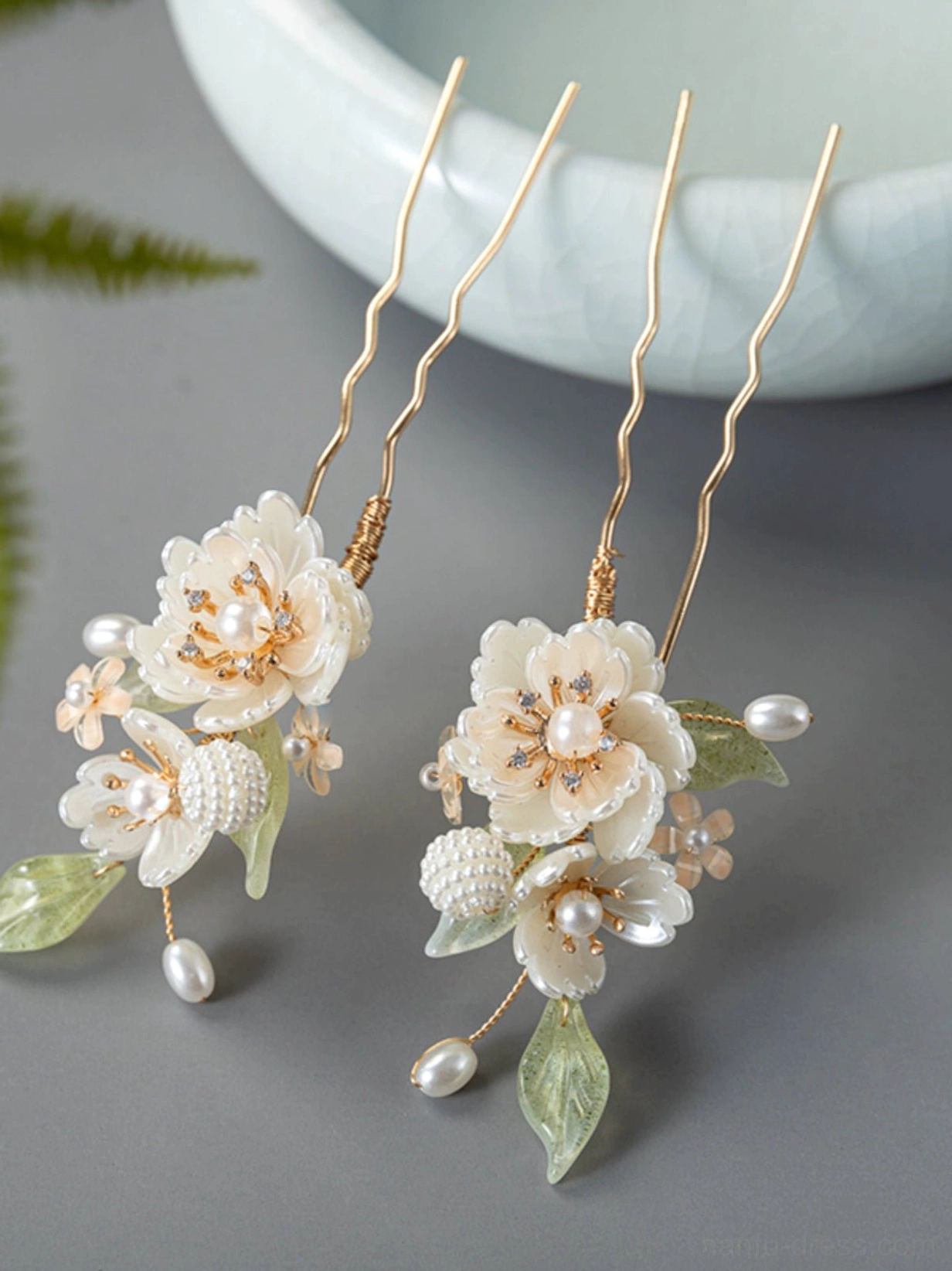Matching white peony U-shaped Hanfu hairpins with faux pearls, green leaf details, gold-tone hair sticks, and pearl drop pendants