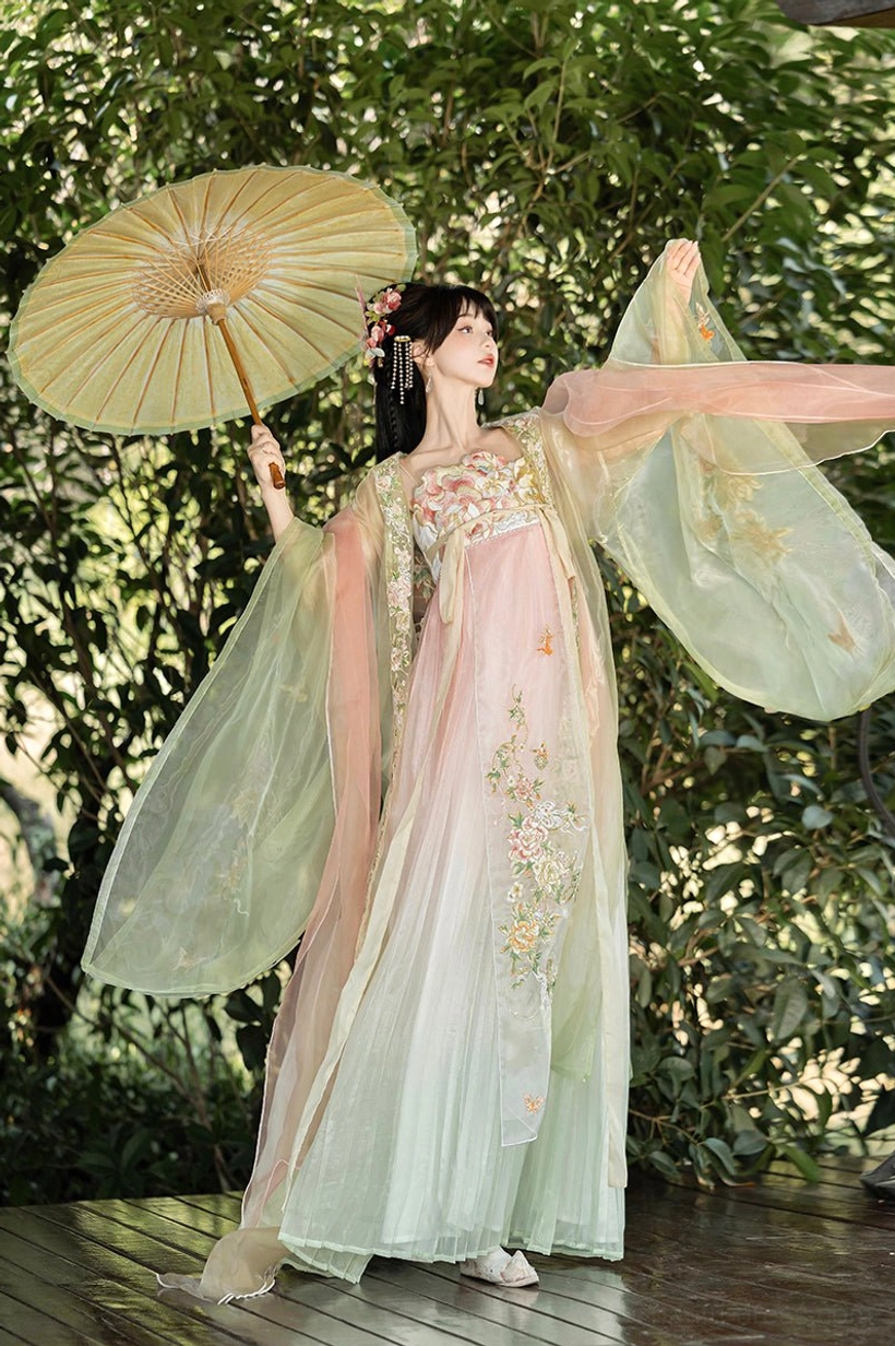 Apricot to mint green Tang Dynasty Hanfu Heziqun dress with lightweight sheer fabric and floral embroidery outdoors