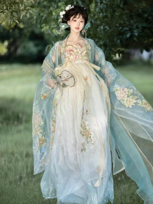 Blue and ivory Tang Dynasty Hanfu Heziqun dress with embroidered gown, sheer outer cape, flower hairpins, and round silk fan