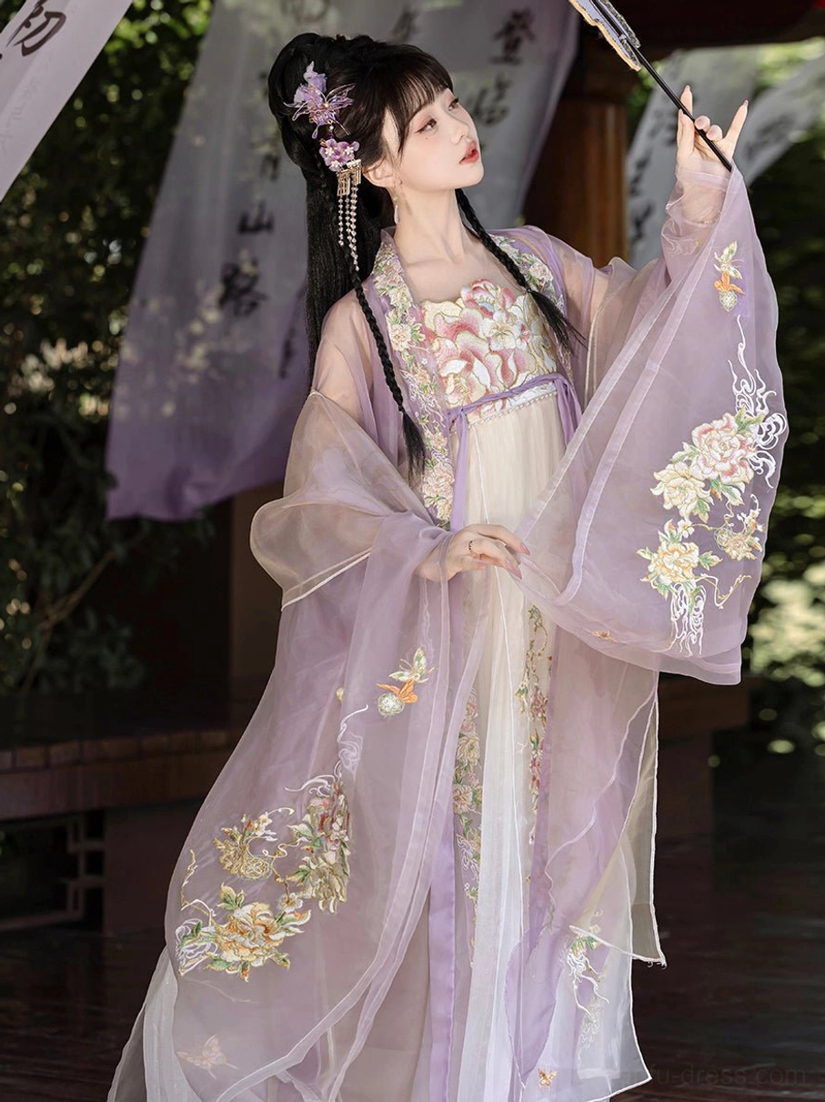 Lavender Tang Dynasty Hanfu Heziqun dress with golden floral embroidery on the gown and sheer cape in a traditional pavilion