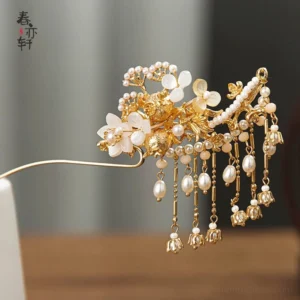 White shell flower pearl tassel Chinese Hanfu hairpin with gold toned metal base shown on wooden tabletop