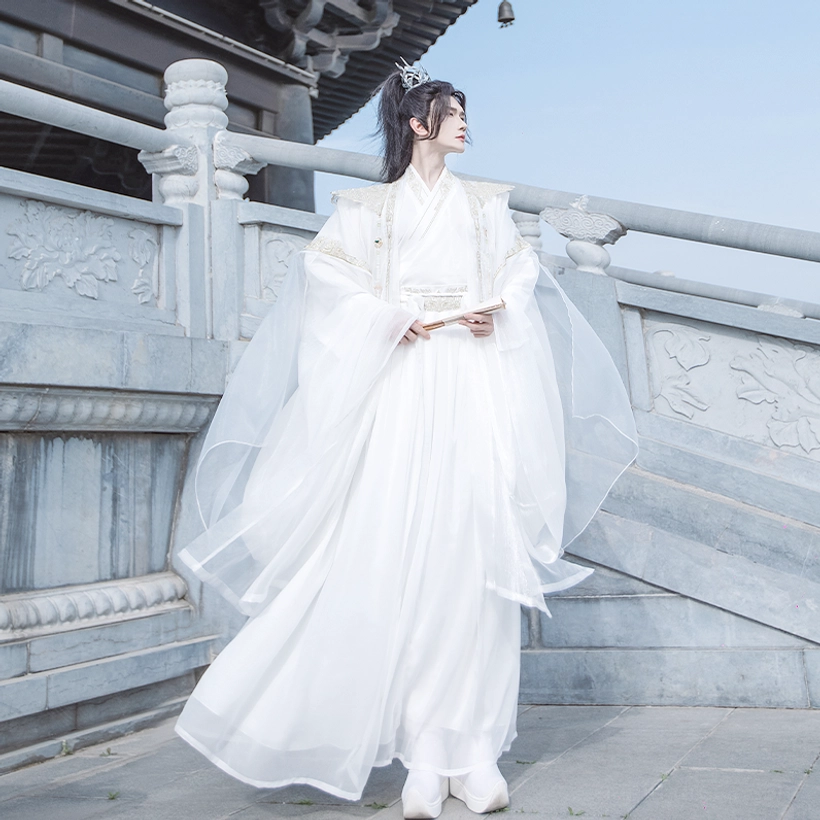 White xianxia hanfu complete set for men with traditional crossover robes, flowing sheer sleeves, and matching white footwear
