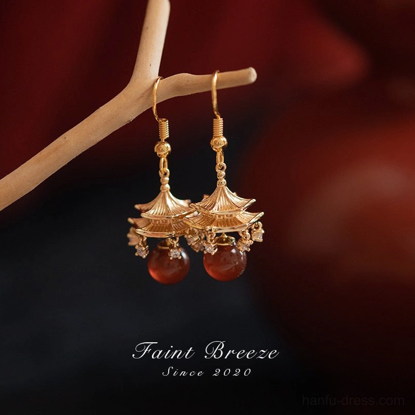 Pair of vintage inspired Chinese pavilion drop earrings with gold tone architectural charms and red agate-style pendants for Hanfu