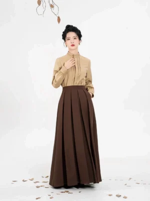Modern Chinese Hanfu separates featuring a beige pleated standing-collar long-sleeve blouse and deep brown pleated mamianqun horse face skirt