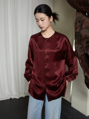 Wine red modern Chinese style Hanfu satin shirt with crew neck front buttons dropped shoulders and relaxed silhouette