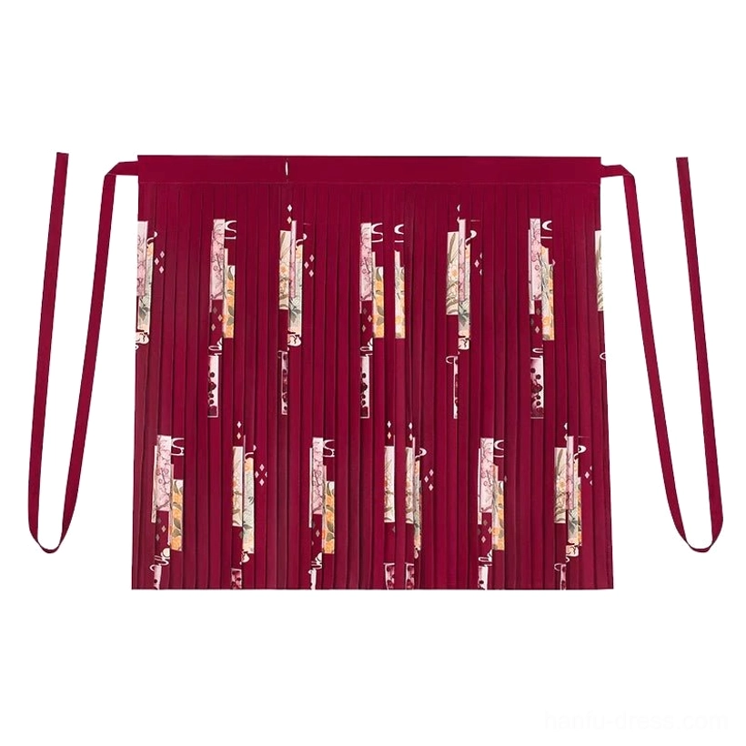 Flat lay of a wine red Song Dynasty hanfu pleated skirt with seasonal flower print, long waist sashes, and full flowing pleated structure