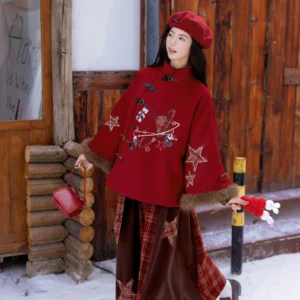 Wine red sweet plaid Chinese New Year jacket with frog buttons and fuzzy brown cuffs worn in a snowy winter cabin setting
