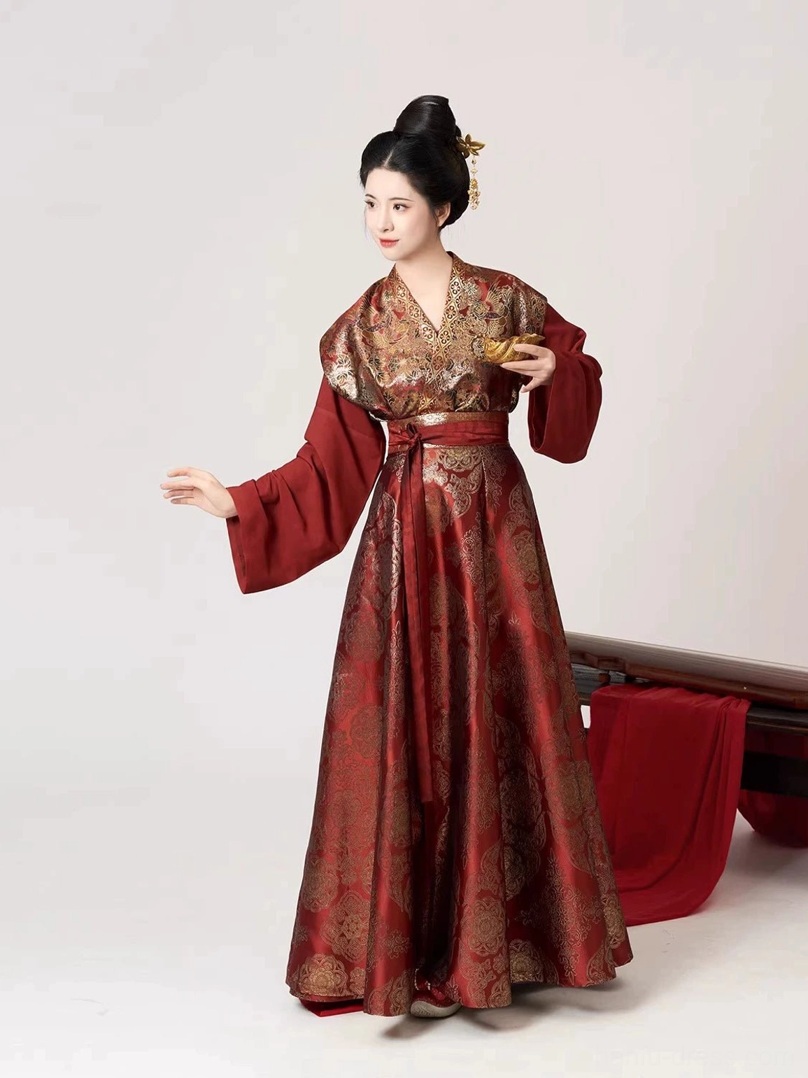 Side view of wine red Tang Dynasty Hanfu outfit with wide sleeves, layered Beizi overlay, and long wrap skirt
